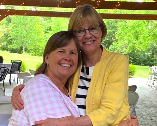 Two women hugging